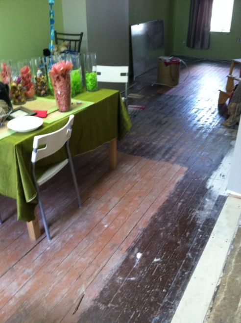 The wood floor beneath the carpet was painted two different colors.