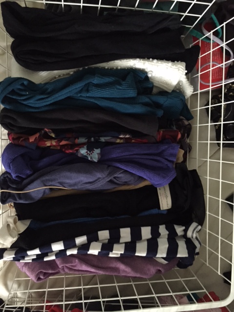 Folded shirts stored vertically