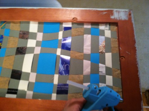 Transfer your weaving into the frame and glue the edges in place.