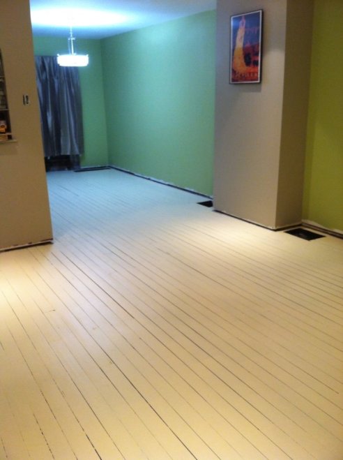 Against everyone's better judgement, I painted the floor a light sandy color because I couldn't afford to refinish it.