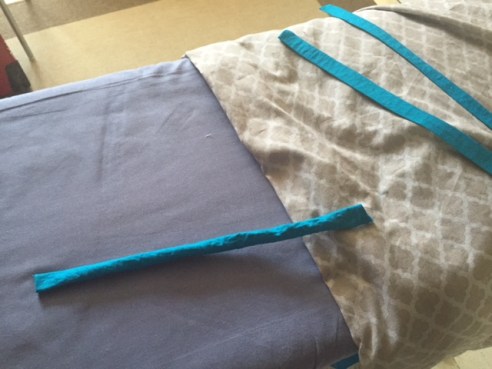 I made a reversible duvet cover out of gray and teal fabric, with teal ties.
