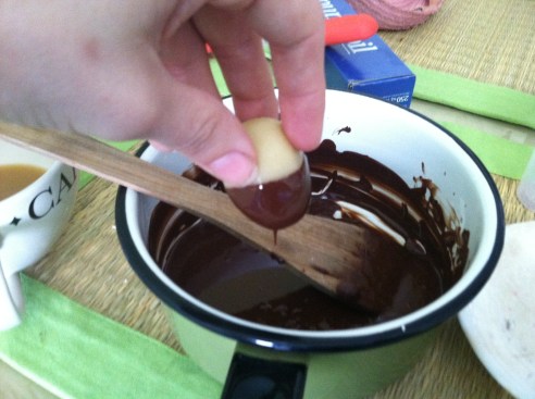 Dip the bottom half of your first egg