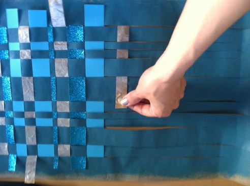 Weave your paper strips over, then under.