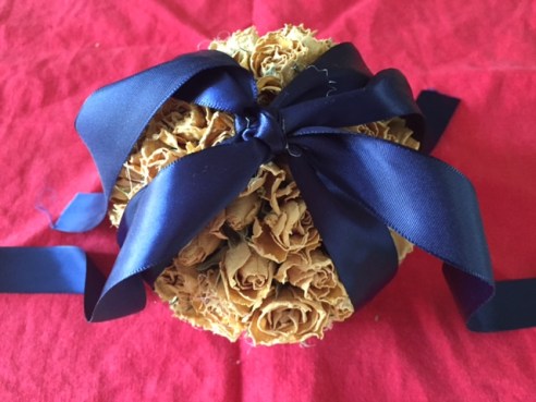 Add two pieces of ribbon and tie them in a bow at the top of each pomander.