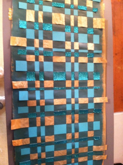 When you finish weaving, check that all of the edges are glued down. This is back of the finished product.